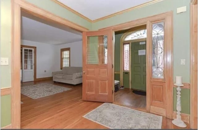 75 William St, Worcester, MA 01609 - entryway featuring baseboards, wood finished floors, and ornamental molding