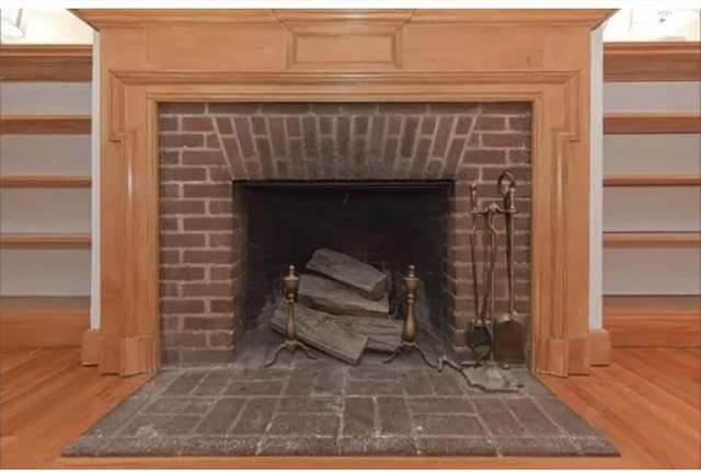 75 William St, Worcester, MA 01609 - room details featuring a fireplace and wood finished floors