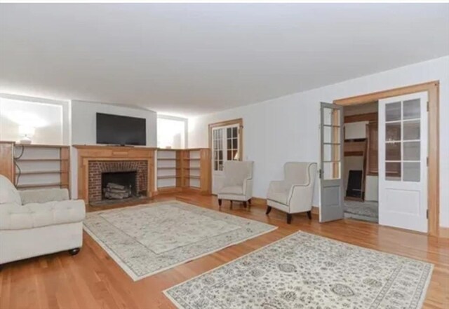 75 William St, Worcester, MA 01609 - living room featuring a fireplace and wood finished floors