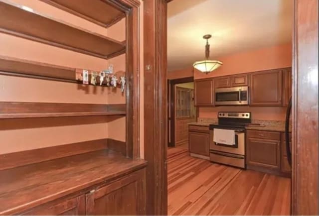 75 William St, Worcester, MA 01609 - kitchen featuring decorative light fixtures, appliances with stainless steel finishes, and light wood finished floors