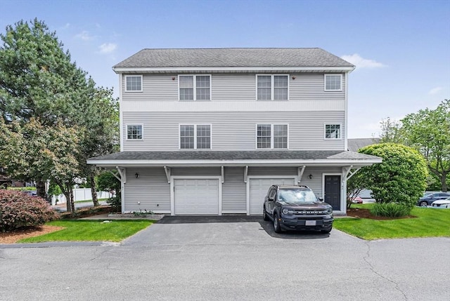 14 Ship Ave Unit 1, Medford, MA 02155 - view of front facade featuring asphalt driveway and an attached garage