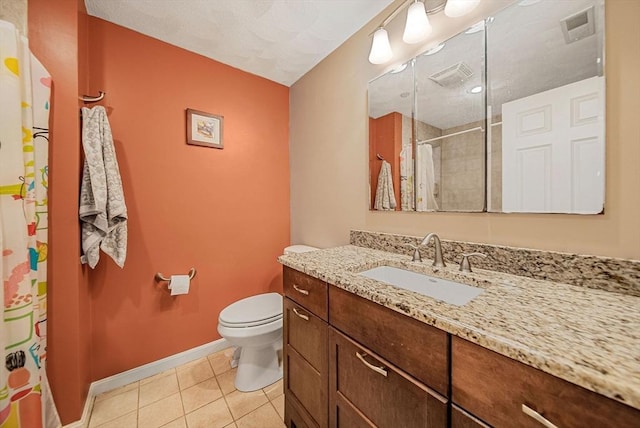 14 Ship Ave Unit 1, Medford, MA 02155 - bathroom with tile patterned floors, baseboards, a shower with shower curtain, toilet, and vanity