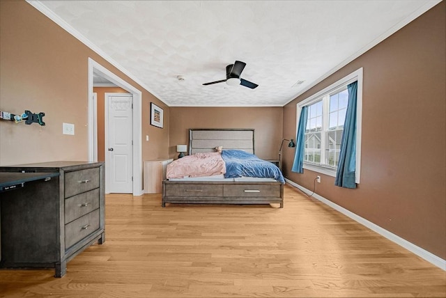 14 Ship Ave Unit 1, Medford, MA 02155 - bedroom with crown molding, light wood finished floors, baseboards, and ceiling fan