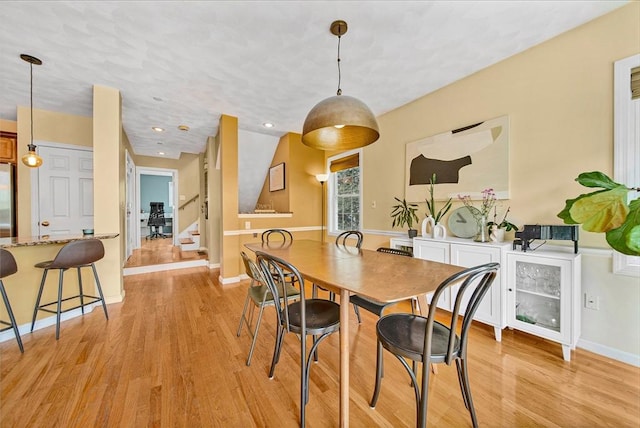 14 Ship Ave Unit 1, Medford, MA 02155 - dining area with light wood-style floors, stairs, baseboards, and recessed lighting
