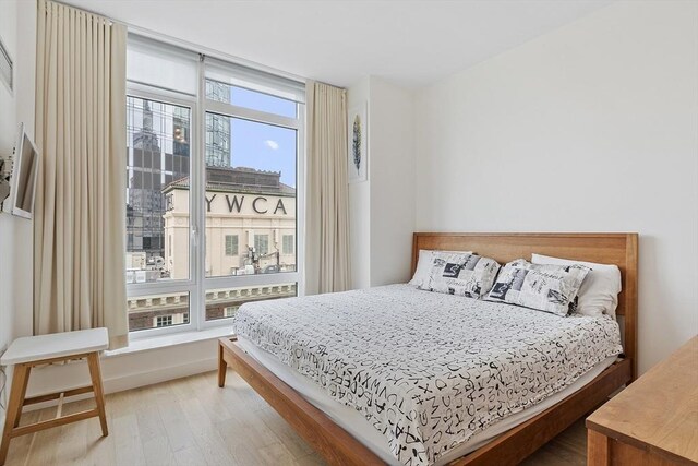 bedroom featuring wood finished floors