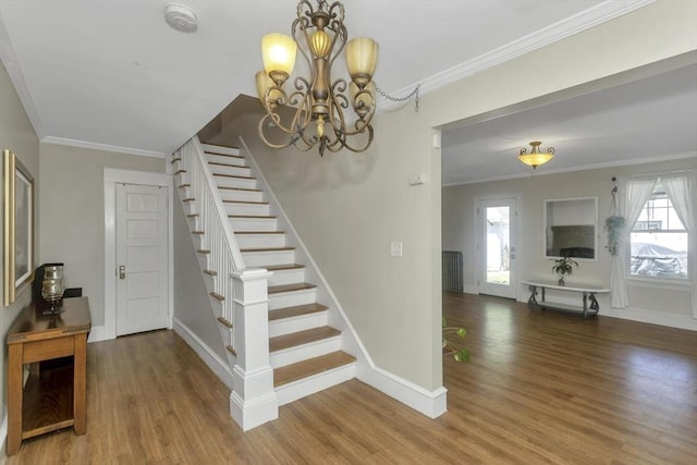 51 Stratford Ter, Springfield, MA 01108 - stairway with wood finished floors, a chandelier, baseboards, and crown molding