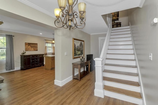 51 Stratford Ter, Springfield, MA 01108 - staircase featuring baseboards, wood finished floors, crown molding, and a chandelier