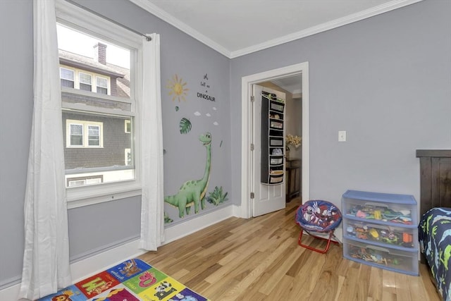 51 Stratford Ter, Springfield, MA 01108 - playroom with wood finished floors, ornamental molding, and baseboards