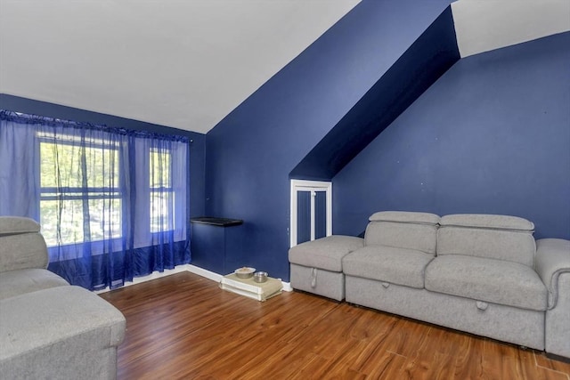 51 Stratford Ter, Springfield, MA 01108 - living area with lofted ceiling, wood finished floors, and baseboards