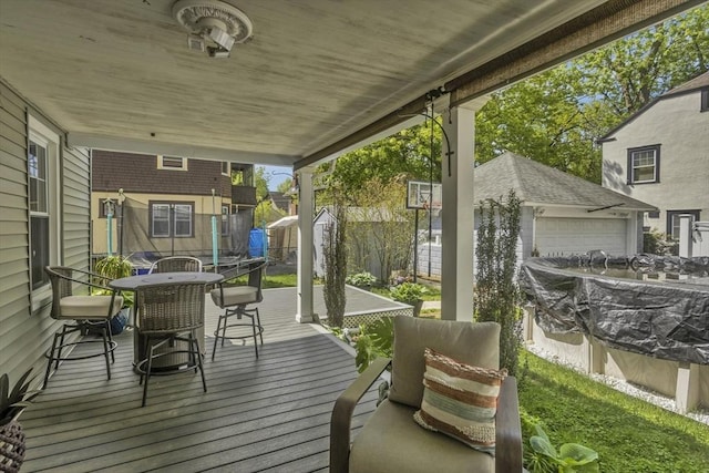 51 Stratford Ter, Springfield, MA 01108 - wooden terrace featuring outdoor dining area and a garage
