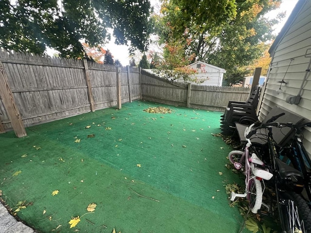 view of yard with a fenced backyard