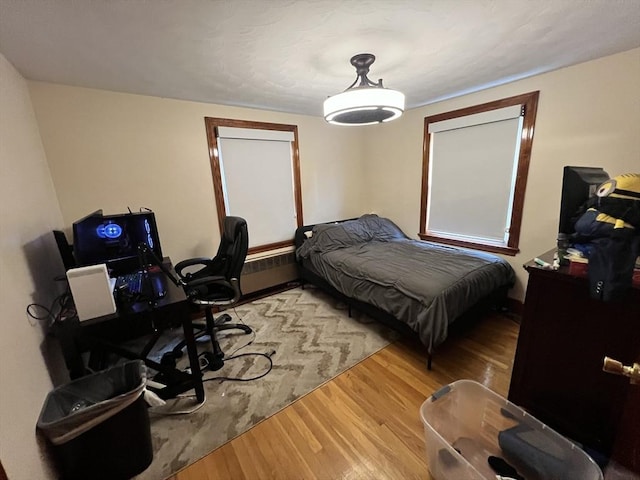 bedroom featuring wood finished floors