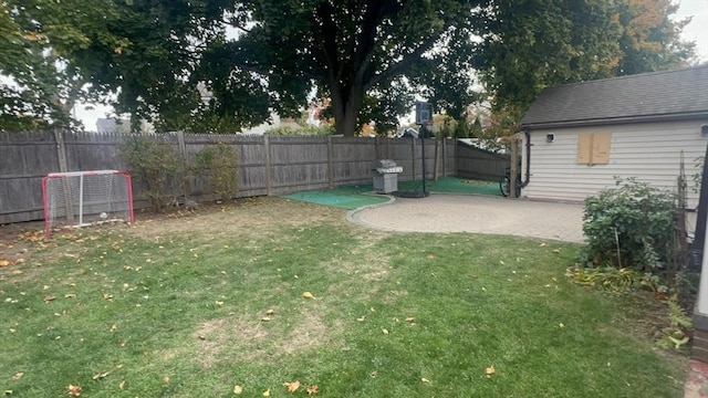 view of yard featuring a patio area and a fenced backyard