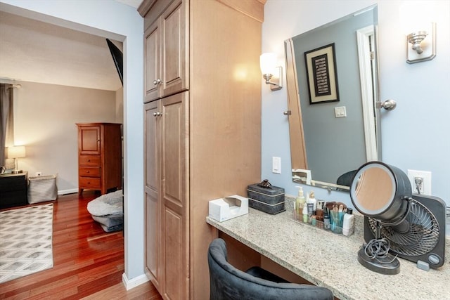 1102 Foxwood Cir Unit 1102, Peabody, MA 01960 - bathroom with wood finished floors, vanity, and baseboards