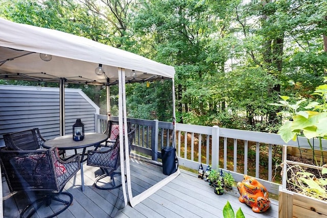 1102 Foxwood Cir Unit 1102, Peabody, MA 01960 - wooden terrace featuring outdoor dining space and a gazebo