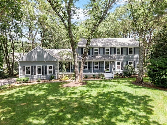 6 Candida Ln, Acton, MA 01720 - colonial house with a porch, a front lawn, and a shingled roof