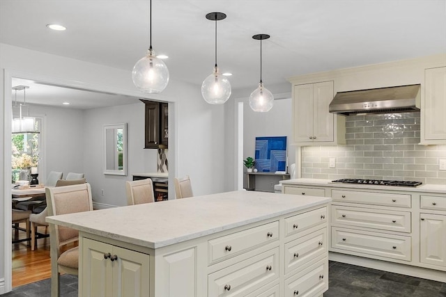 6 Candida Ln, Acton, MA 01720 - kitchen featuring wall chimney range hood, gas stovetop, tasteful backsplash, a center island, and light stone counters