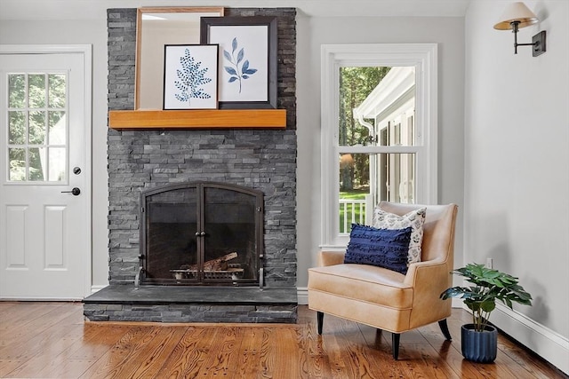 6 Candida Ln, Acton, MA 01720 - living area with wood finished floors and a stone fireplace