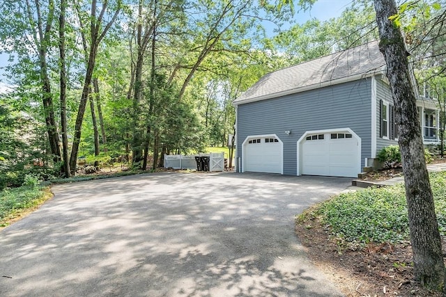 6 Candida Ln, Acton, MA 01720 - view of home's exterior with asphalt driveway and a shingled roof