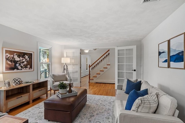 6 Candida Ln, Acton, MA 01720 - living room with wood finished floors and stairs