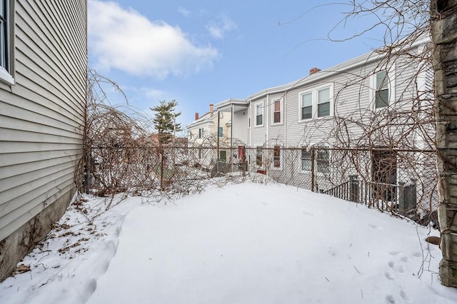 view of yard covered in snow