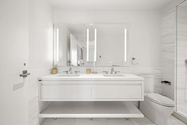 bathroom with vanity, toilet, and an enclosed shower