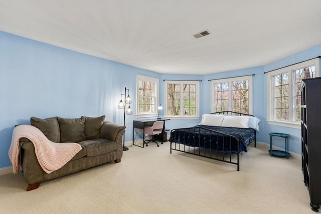 bedroom featuring carpet flooring, visible vents, and baseboards