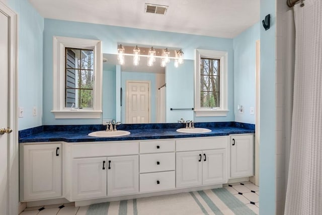 bathroom featuring a sink, visible vents, double vanity, and a shower with shower curtain