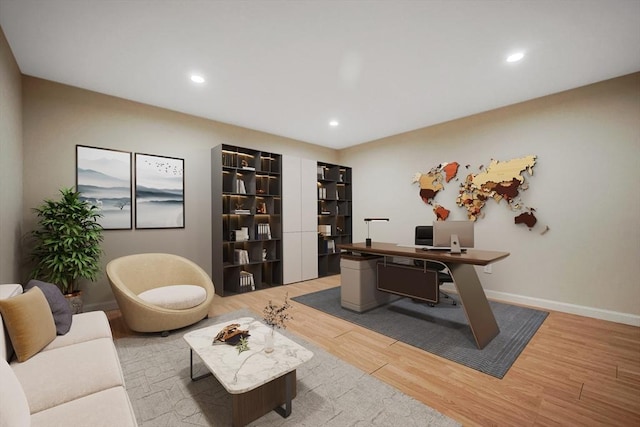 office area featuring recessed lighting, baseboards, and light wood finished floors