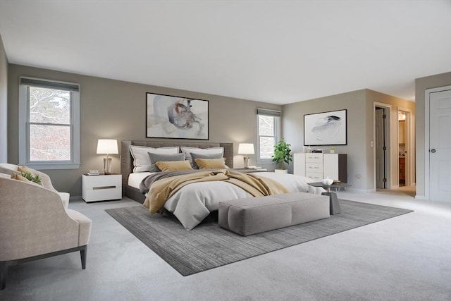 bedroom with baseboards and light carpet