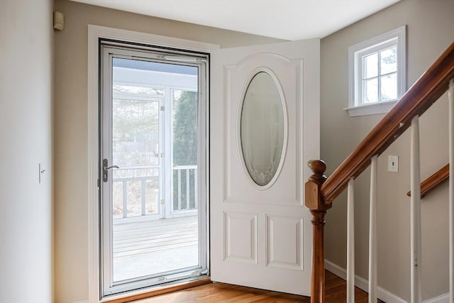 entryway with stairway and wood finished floors