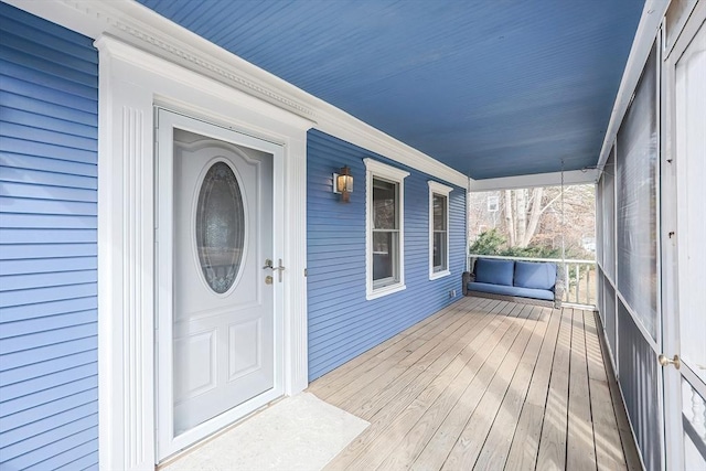 property entrance featuring a porch