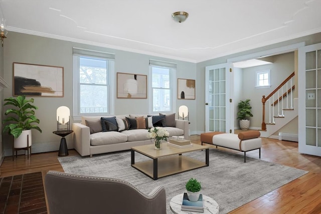 living area featuring wood finished floors and ornamental molding