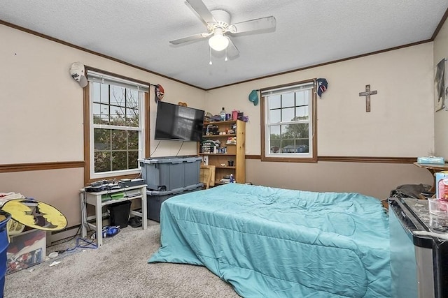 bedroom with carpet flooring, multiple windows, crown molding, a textured ceiling, and ceiling fan