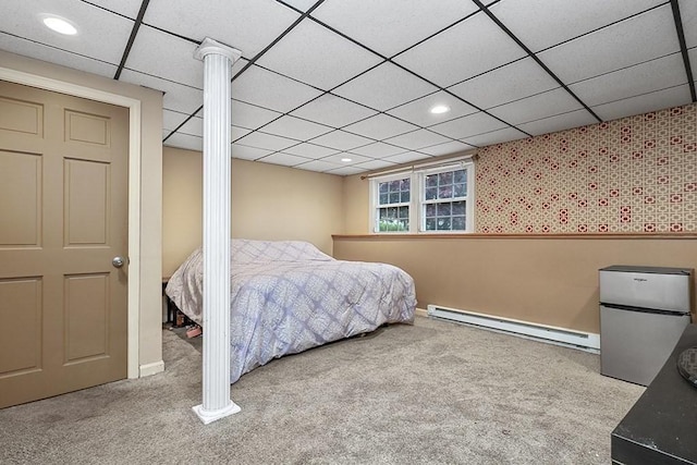 bedroom with baseboard heating, carpet flooring, freestanding refrigerator, recessed lighting, and a paneled ceiling