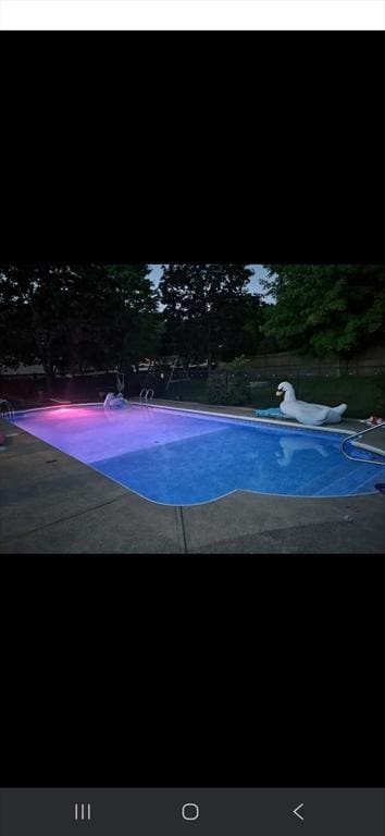outdoor pool with a patio
