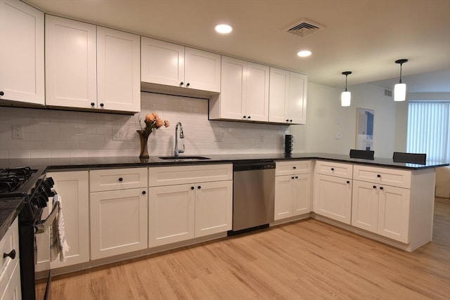 kitchen featuring black range with gas cooktop, visible vents, stainless steel dishwasher, dark countertops, and pendant lighting