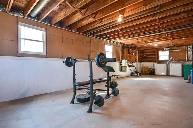 exercise room featuring plenty of natural light and independent washer and dryer