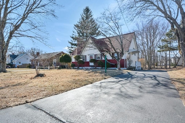 exterior space with a residential view and driveway