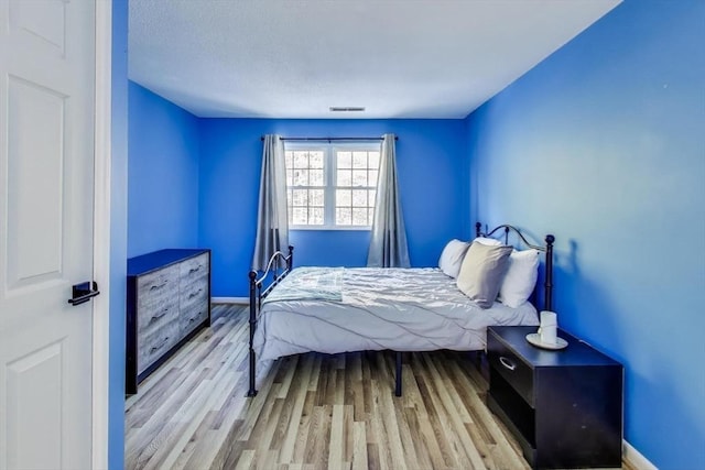 bedroom featuring light hardwood / wood-style floors