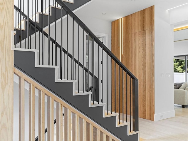 staircase featuring hardwood / wood-style floors