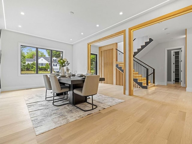 dining space with light wood-type flooring