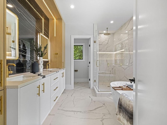 bathroom featuring independent shower and bath and vanity