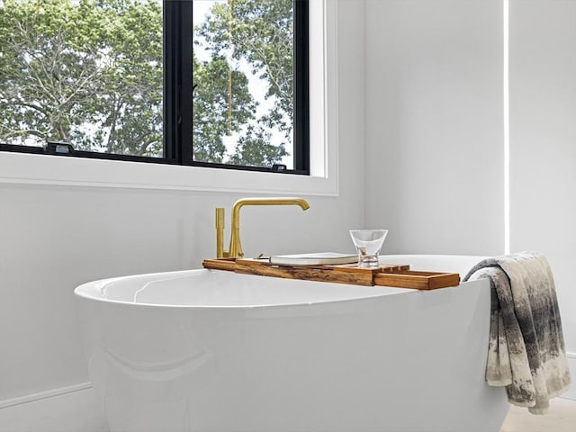 bathroom featuring a tub