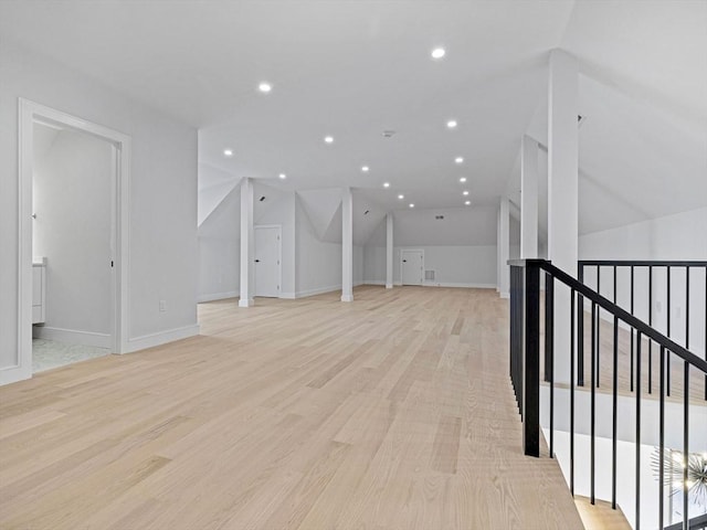 bonus room featuring light hardwood / wood-style flooring and lofted ceiling