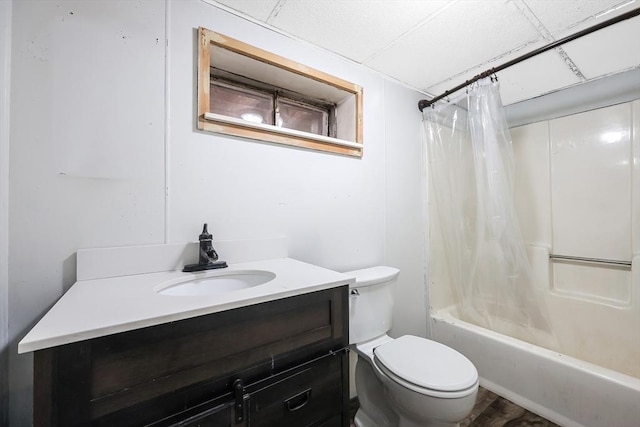 bathroom featuring shower / bathtub combination with curtain, toilet, and vanity