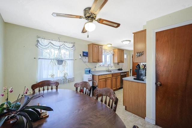 dining space with light floors and ceiling fan