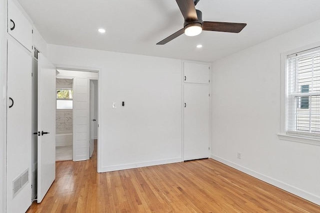 unfurnished bedroom with visible vents, recessed lighting, light wood-style flooring, and baseboards