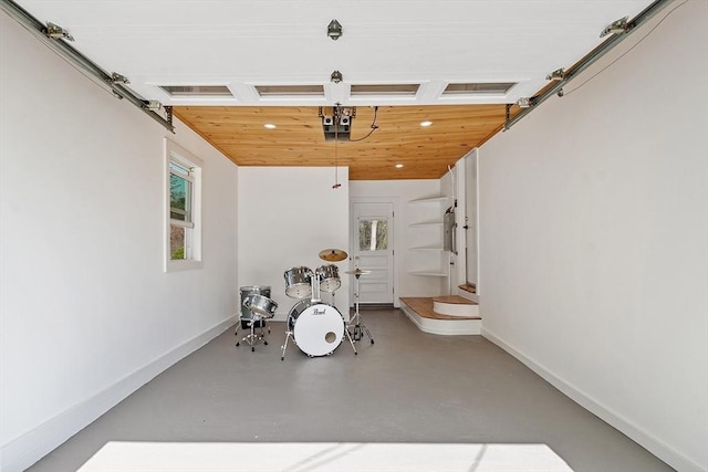garage with recessed lighting, baseboards, and wood ceiling