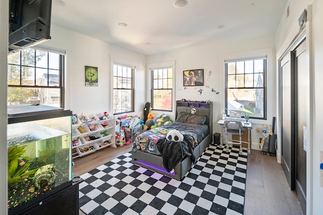 bedroom with wood-type flooring